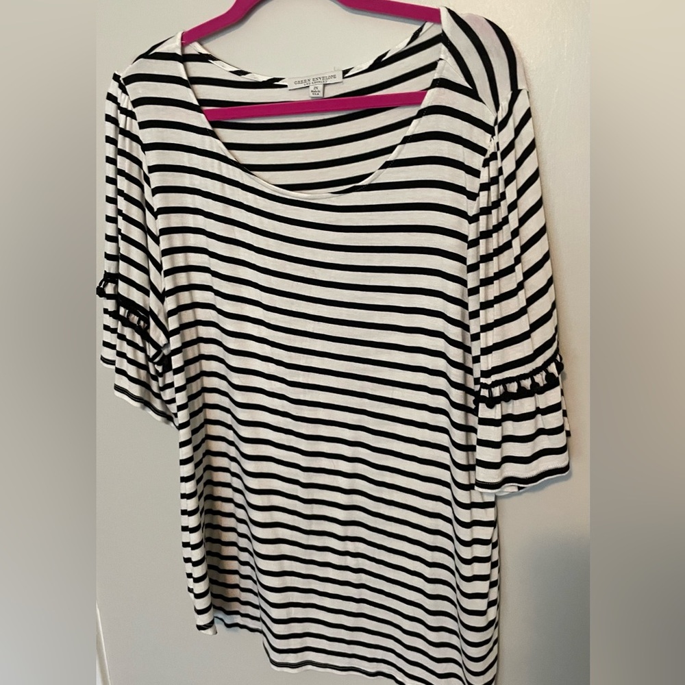 Stretchy black and white top with Pom Pom detail